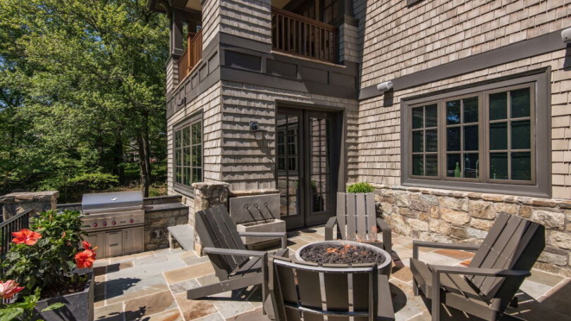 Raised Terrace with Firepit complementing a Shingle Style Home - McLean, Virginia